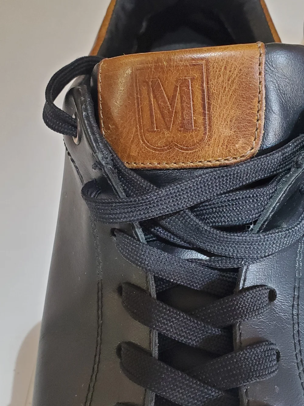 Bruno Magli Men's Black Leather Low-Top Sneakers with Brown Accent